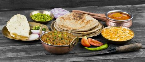 Indian Cuisine Sev Tamatar on Wooden Table photo