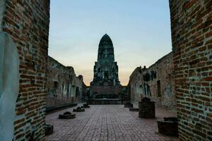 the ruins of wat phra kaeo at sunset photo