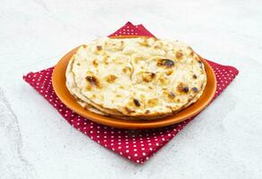 Indian Cuisine - Tandoori Roti whole wheat flat bread photo