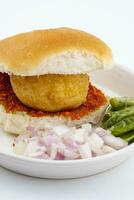 Indian Famous Street Food Vada Pav is a Vegetarian Fast Food Dish From Maharashtra photo