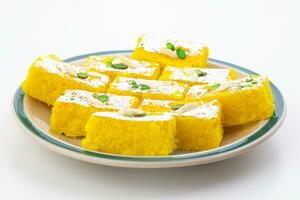 Indian Popular Sweet Food Khopara Pak or Coconut Burfi on White Background photo