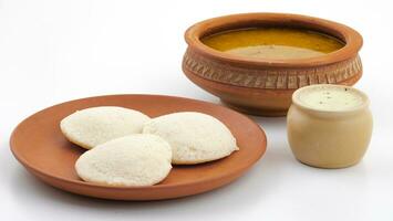 South Indian Popular Breakfast Idli or Idly Served With Sambar And Coconut Chutney photo