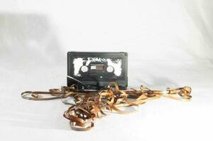 a cassette with tape coming out of it photo