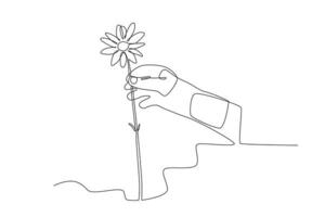 A hand holding a spring flower vector