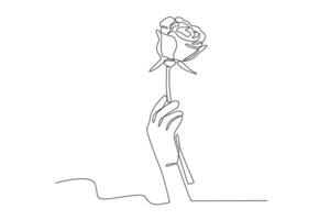 A hand holding a rose vector