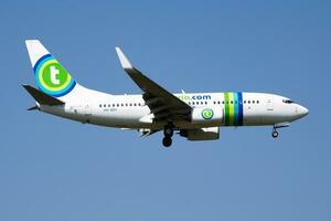 Transavia Boeing 737-700 PH-XRY passenger plane arrival and landing at Vienna Airport photo