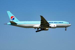 Korean Air Cargo Boeing 777-200 HL8045 cargo plane arrival and landing at Vienna Airport photo