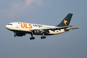 ULS Cargo Airbus A310 TC-VEL cargo plane arrival and landing at Vienna Airport photo