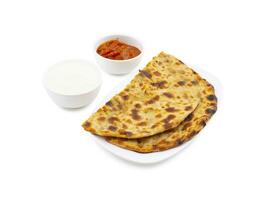 Indian Traditional Breakfast Dish Aloo Paratha Served With Fresh Curd And Pickle photo