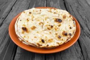 Indian Cuisine - Tandoori Roti whole wheat flat bread photo