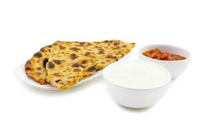 Indian Traditional Breakfast Dish Aloo Paratha Served With Fresh Curd And Pickle photo