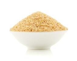 Raw Cereal Food Also Know as Bulgur, Dalia or Daliya on White Background photo