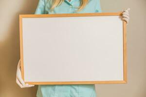 Image of medical nurse holding whiteboard. photo
