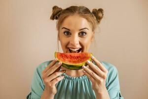 Portrait of happy cute woman enjoys eating watermelon.Toned image photo