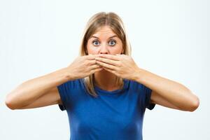 Shocked woman covering her mouth photo