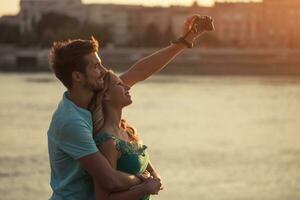 Young happy couple taking selfie with camera. photo