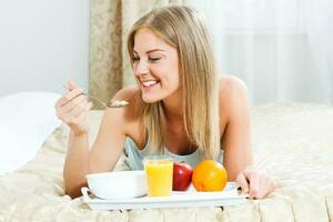 Beautiful woman having healthy breakfast photo