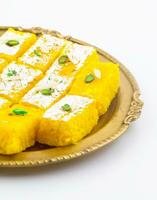 Indian Popular Sweet Food Khopara Pak or Coconut Burfi on White Background photo