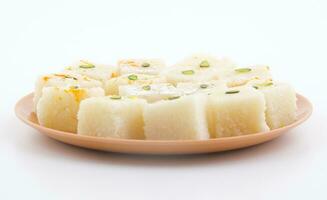 Indian Popular Sweet Food Khopara Pak or Coconut Burfi on White Background photo