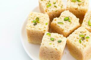 Indian Traditional Famous Sweet Food Mysore Pak or Mysoor Pak on White Background photo