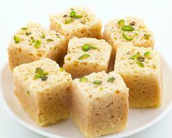 Indian Traditional Famous Sweet Food Mysore Pak or Mysoor Pak on White Background photo