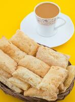 Indian Tea Time Breakfast Khari on Yellow Background photo