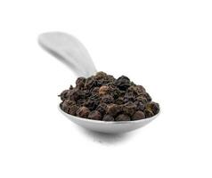 Organic Black Pepper in Spoon on White Background photo
