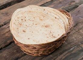 Indian Traditional Cuisine Chapati on Wooden Background photo