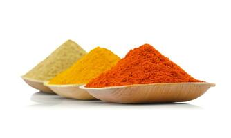 Indian Colorful Spices Also Know as Red Chilli Powder, Turmeric Powder, Coriander Powder photo