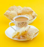 Indian Tea Time Breakfast Khari on Yellow Background photo