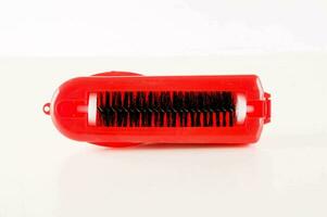 a red brush with black bristles photo
