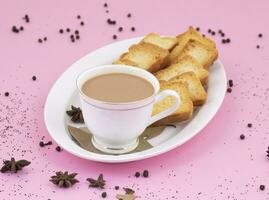 Indian Popular Drink Masala Chai or Masala Tea on Pink Background photo