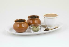 Indian Popular Drink Masala Chai or Masala Tea With Traditional Beverage on White Background photo