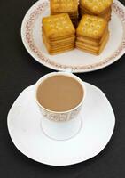 Indian Masala Chai or Morning Tea on Black Background photo