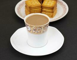 Indian Masala Chai or Morning Tea on Black Background photo