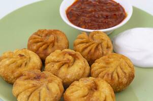 Fried Momos is a Traditional Dumpling Food From Nepal photo