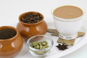 Indian Popular Drink Masala Chai or Masala Tea With Traditional Beverage on White Background photo