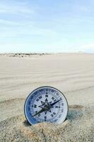 a compass on the beach photo