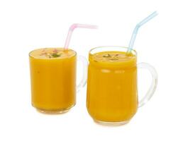 Fresh mango fruit juice on white background photo