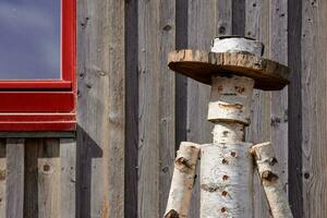 a wooden man with a hat photo