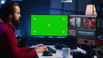 Videographer uses editing software on green screen computer to assemble footage into cohesive final result. Expert color correcting clips on mockup monitor to ensure project meets desired aesthetic video