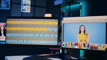 Empty media agency office with multi monitors setup used for post processing image color grading. Editing software interface on desktop PC in specialized graphic design creative studio photo