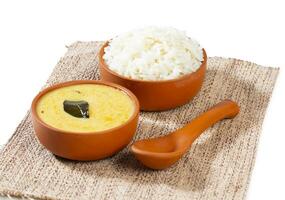 Indian Traditional Cuisine Kadhi Chawal Also Know as Curry Chawal, Yogurt Curry with Rice on White Background photo