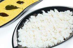 Indian Traditional Cuisine Kadhi Chawal Also Know as Curry Chawal, Yogurt Curry with Rice on White Background photo