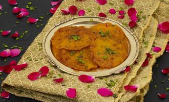Indian Traditional Popular Sweet Food Malpua or Amalu Are Small Sweet Pancakes Traditionally Made During Festivals photo