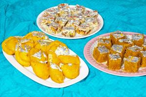 Indian Diwali Sweet Food Chandrakala with Sugar Free Dry Fruits, Mung Dal Chakki And Sweet Samosa photo