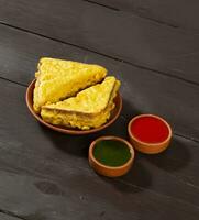 Indian Fried Snack Bread Pakora or Bread Bhaji Served with Tomato Ketchup, Green Chutney it is Made From Bread Slices photo