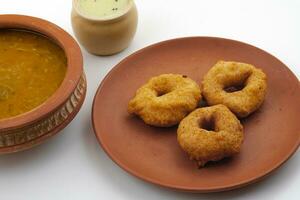 South Indian Popular Breakfast Vada Served With Sambar And Coconut Chutney photo