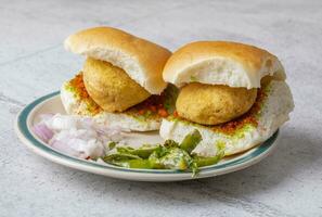 Indian Famous Street Food Vada Pav is a Vegetarian Fast Food Dish From Maharashtra photo