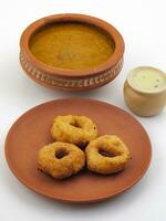 South Indian Popular Breakfast Vada Served With Sambar And Coconut Chutney photo